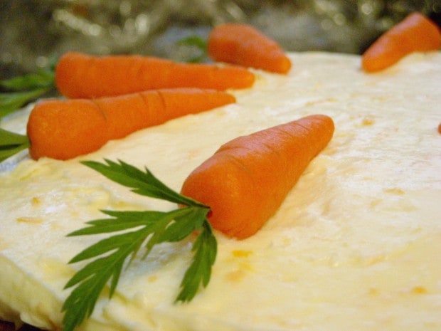 This sweet recipe for orange cream cheese frosting and marzipan carrots. It's the perfect topping for brownies, cake or cookies. 