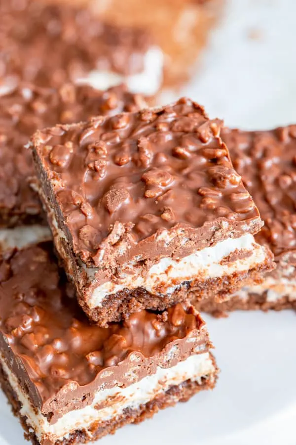 Peanut Butter Marshmallow Krispie Topped Brownies sliced to show the layers. 