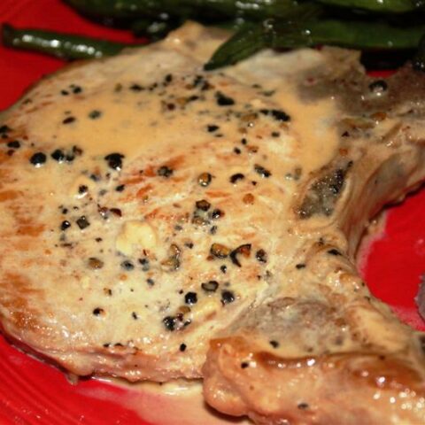 These pork chops au poivre are smothered in a homemade peppered sherry cream sauce and cooked until perfection. The best part is that it's ready in 30 minutes!