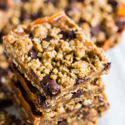 These chewy caramel oatmeal bars are super easy to make and make the perfect dessert treat for any holiday party. They are a delicious combination of oatmeal cookie, chewy caramel, and chocolate. 