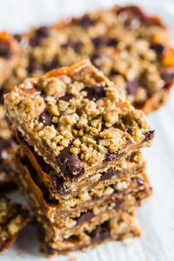 These chewy caramel oatmeal bars are super easy to make and make the perfect dessert treat for any holiday party. They are a delicious combination of oatmeal cookie, chewy caramel, and chocolate. 