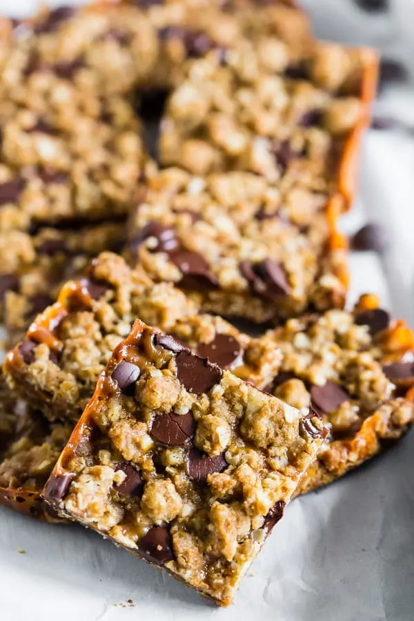 chewy caramel oatmeal bars cut out of the tray. 