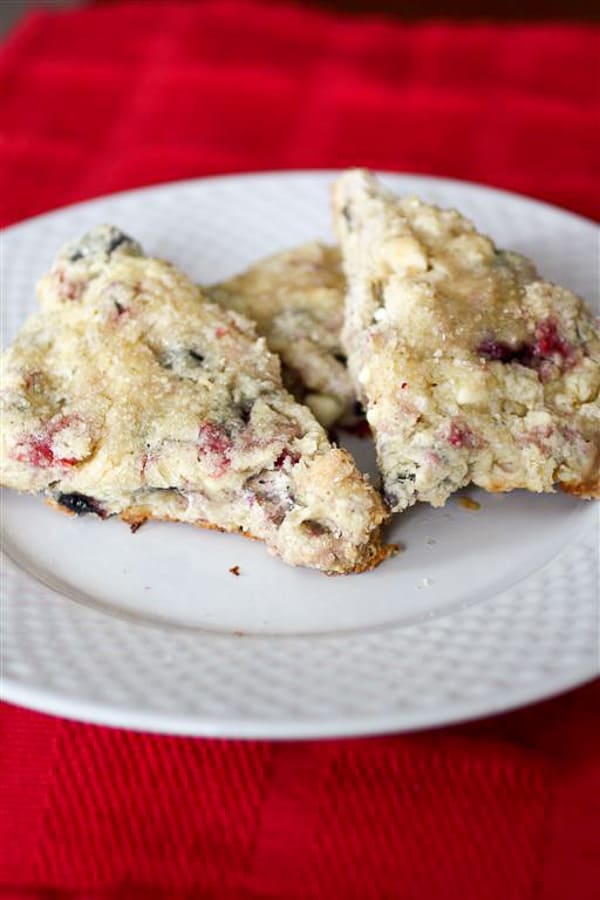 mixed berry white chocolate scones on a plate