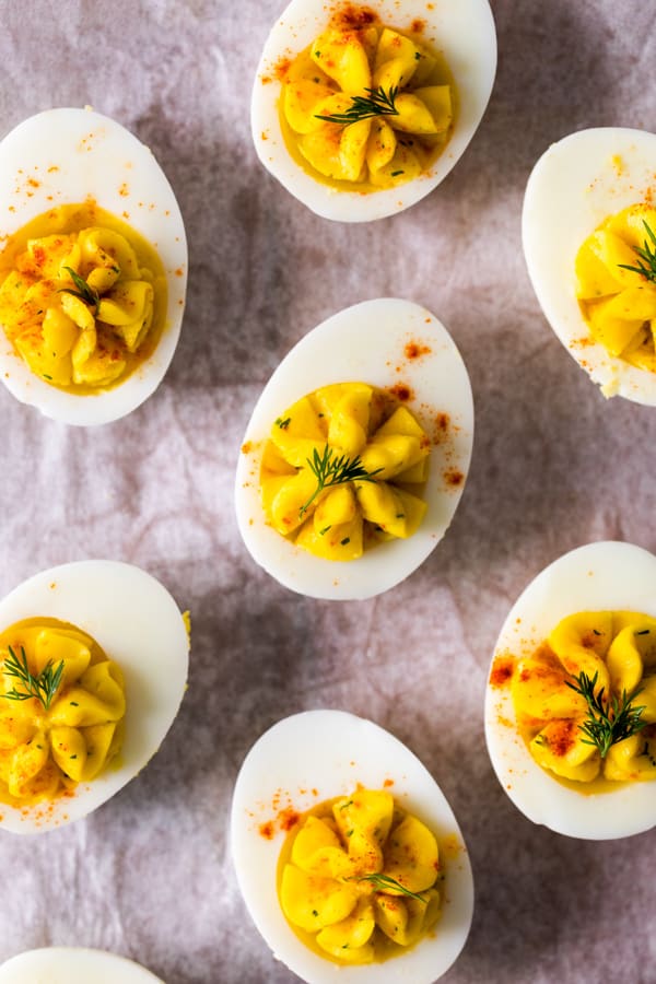 Classic Deviled Eggs topped with paprika and dill. 