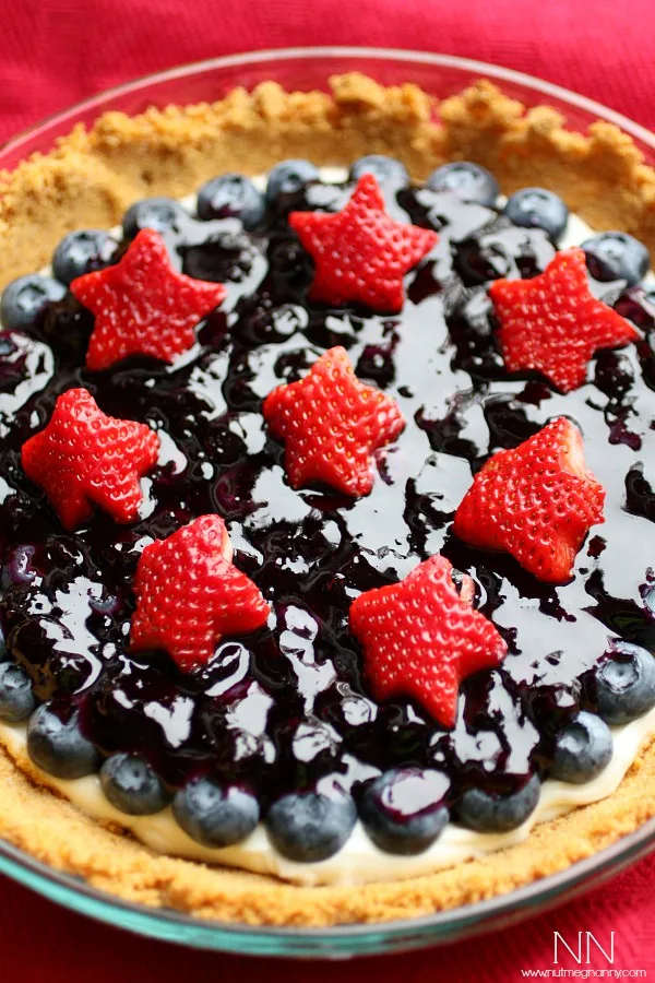 Blueberry Sour Cream Tart topped with berries. 