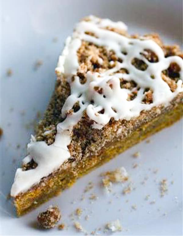 a slice of pumpkin coffee cake with brown butter glaze