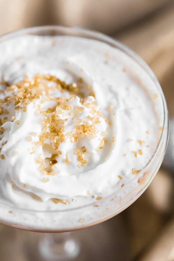 Gingerbread Martini topped with whipped cream and sprinkles. 