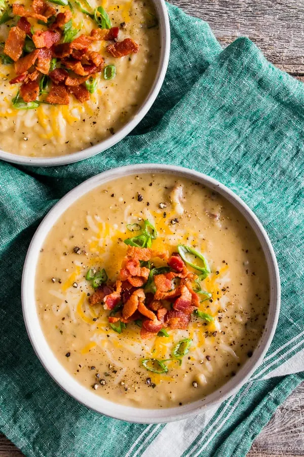 Loaded Baked Potato Soup topping with shredded cheese. 