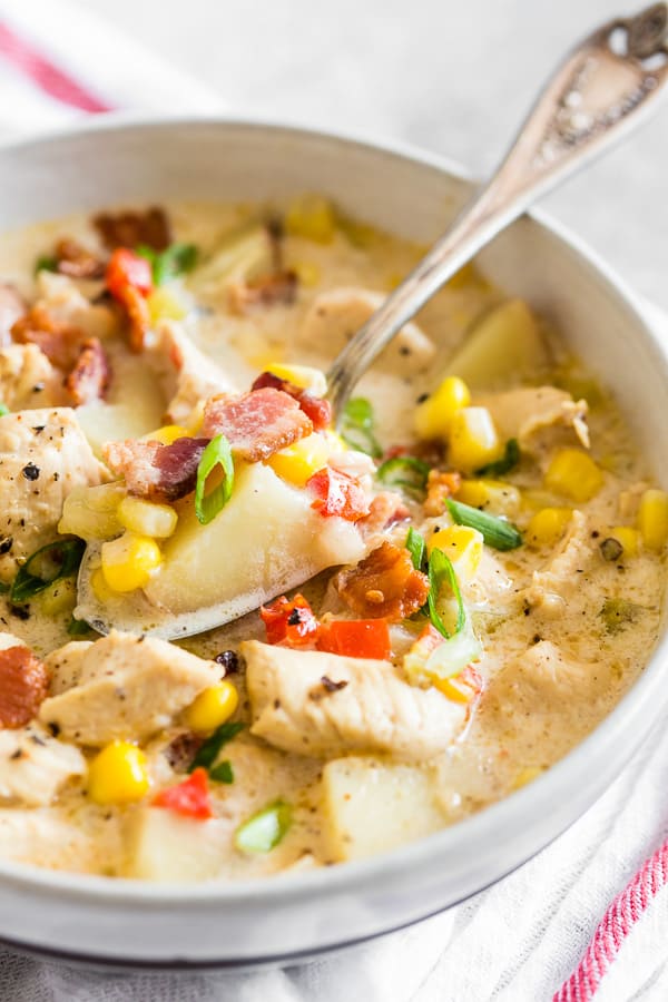 Chicken Corn Chowder in a bowl with a spoon. 