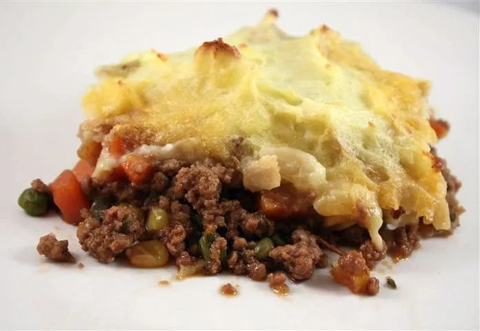 This delicious Irish stout shepherd's pie is full of ground lamb and diced vegetables. The Irish stout creates a thick gravy and is topped with potatoes.