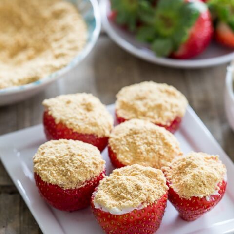 These cheesecake stuffed strawberries are simple to make and perfect for Valentine's Day. Stuffed with sweet cream cheese filling and topped with a dusting of graham cracker crumbs.