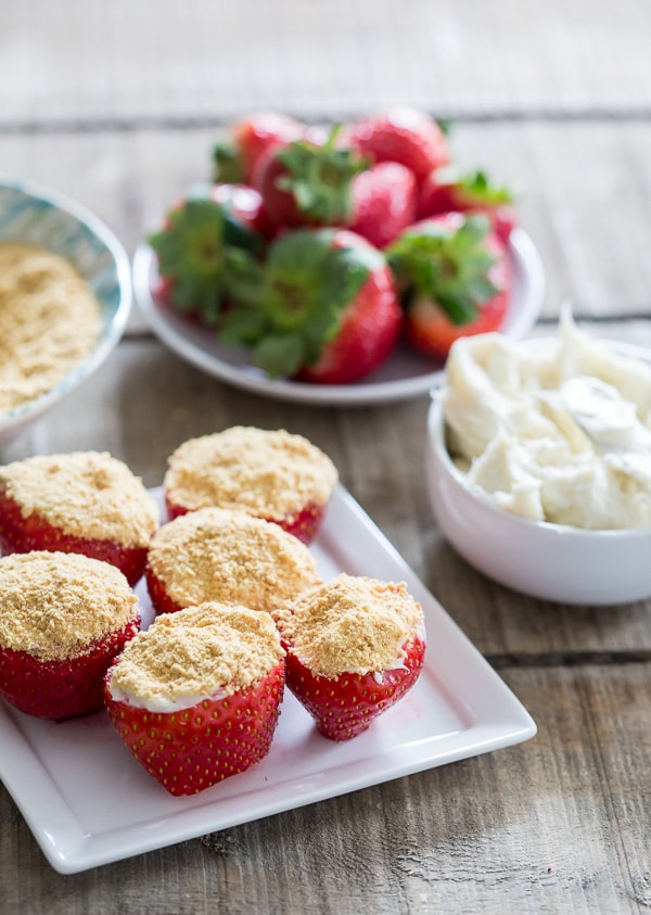 cheesecake stuffed strawberries on a plate