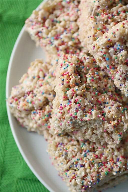 These cake batter Rice Krispie treats are full of cake flavor and lots of sprinkles. Who doesn't love sprinkles with their dessert?