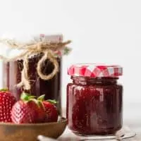 vanilla bean strawberry jam in small glass jars