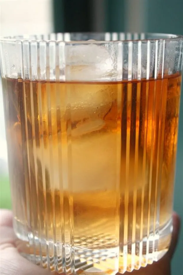 Dark rum cocktail in a glass.