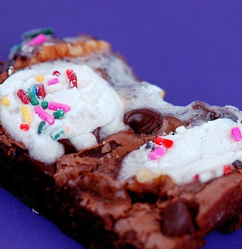 funfetti rocky road brownies cut and served on a plate.