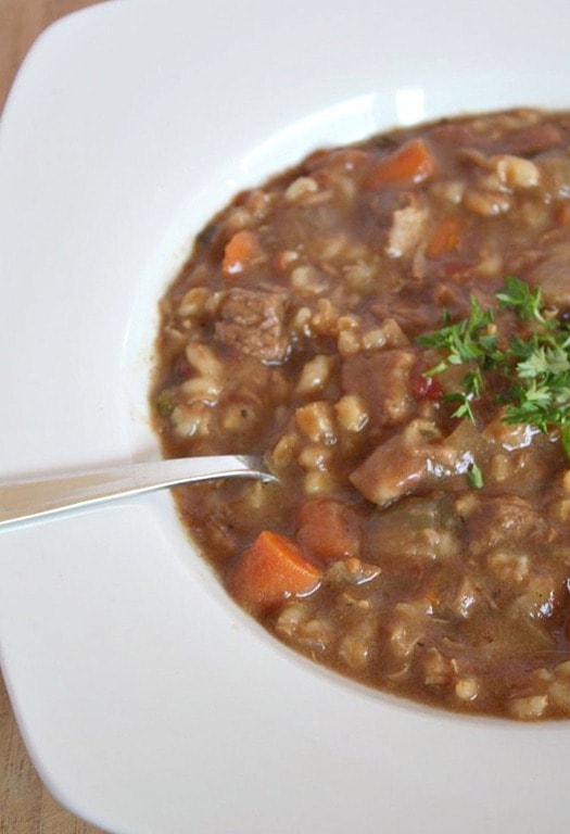 A hearty slow cooker beef barley soup will stick to your bones and keep you full all winter long. It's packed full of vegetables, barley and beef.
