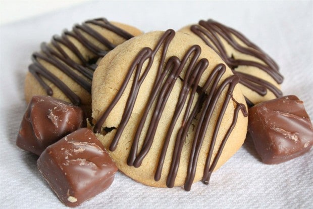 Sweet peanut butter Snicker cookies drizzled with chocolate and made with love. They are the perfect addition to your Christmas platter.