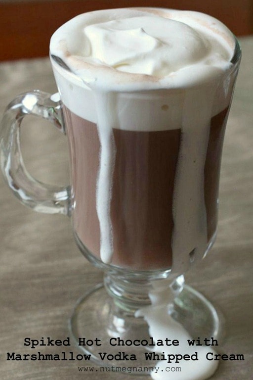 This spiked hot chocolate with marshmallow vodka whipped cream is the perfect cold winter day cocktail. Comforting and delicious. You'll love this!
