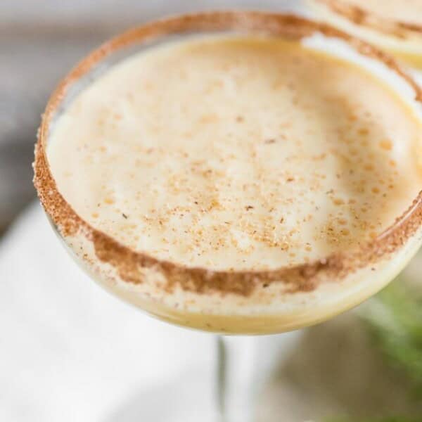 Toast to the holidays with this creamy eggnog martini. It combines delicious eggnog, vanilla vodka, amaretto, and a sprinkle of nutmeg. You'll love this tasty winter cocktail!