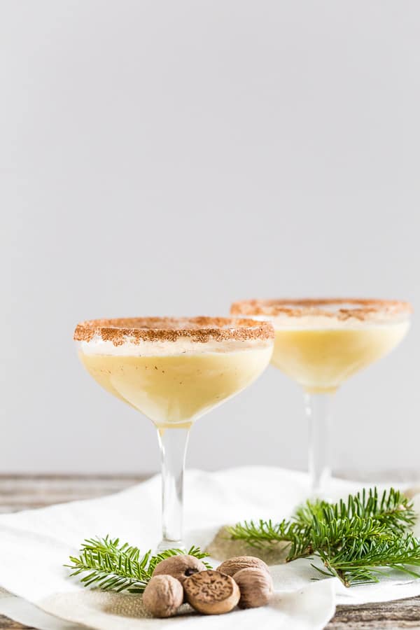 eggnog martini in a glass topped with nutmeg