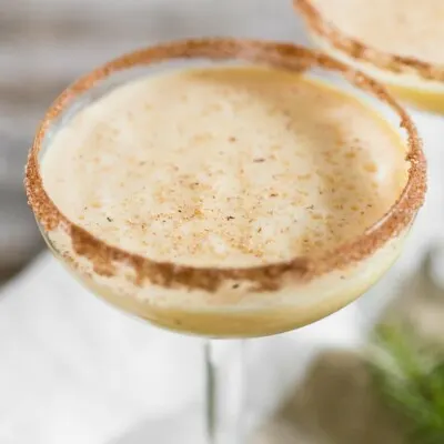 Toast to the holidays with this creamy eggnog martini. It combines delicious eggnog, vanilla vodka, amaretto, and a sprinkle of nutmeg. You'll love this tasty winter cocktail!