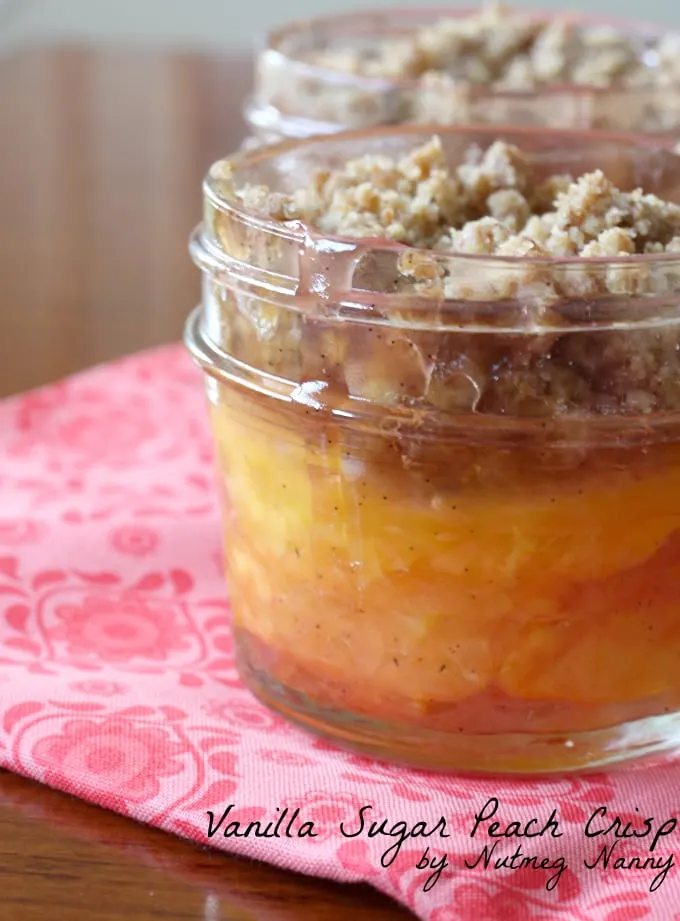 This vanilla sugar peach crisp is baked in tiny mason jars and is the perfect combo of peaches and sweet vanilla sugar. Eat warm out of the oven or with a scoop of vanilla ice cream. 
