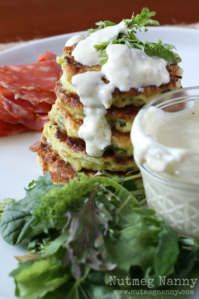 These summer squash pancakes with creamy goat cheese dressing are the perfect addition to your summer menu. I like to serve these as an appetizer but when served with salad they make a fantastic summer meal. Trust me, if you love summer squash and goat cheese this dish is for you!