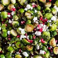 These super simple roasted Brussels sprouts with pomegranate seeds and goat cheese are the perfect dish for your Thanksgiving table. Easy to throw together and packed full of flavor! 