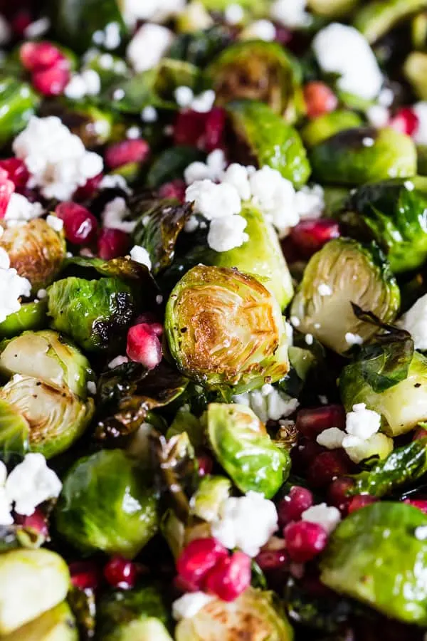 These super simple roasted Brussels sprouts with pomegranate seeds and goat cheese are the perfect dish for your Thanksgiving table. Easy to throw together and packed full of flavor! 
