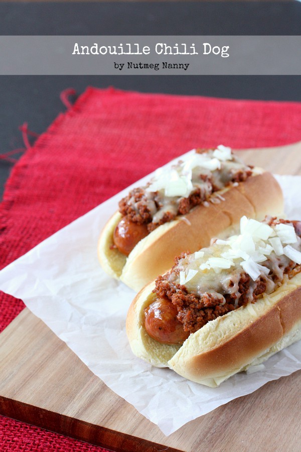 These spicy andouille chili dogs are topped with a homemade chili meat sauce, cheese and just a sprinkling of onions. Spicy and delicious!