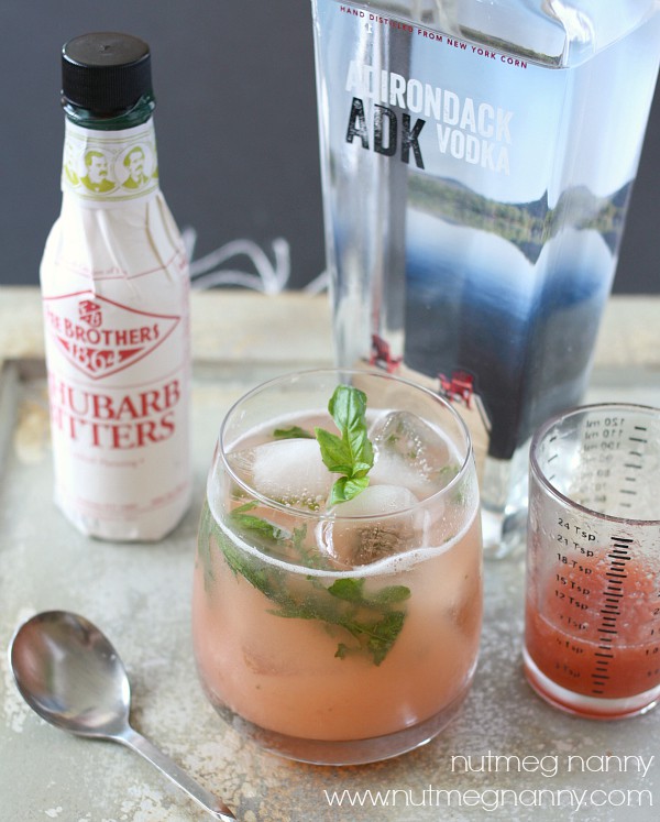 This rhubarb basil smash is the perfect summer cocktail. Delicious homemade rhubarb syrup combined with fresh basil, vodka, and bitters. You'll love this drink! 