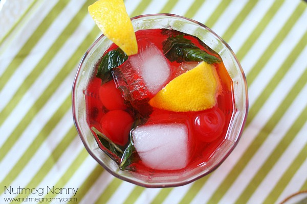 This cherry moonshine summer cocktail is the perfect way to celebrate lazy summer days. It packs a punch by using moonshine cherries, mint, lemon and bubbly seltzer water. You'll love refreshing this cocktail tastes and you'll want to make it all summer long! 