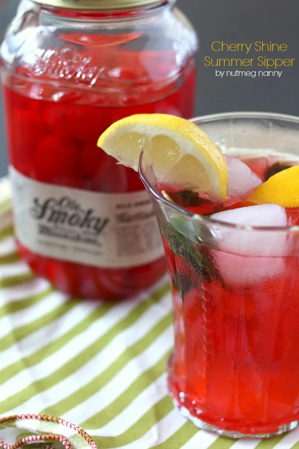 This cherry moonshine summer cocktail is the perfect way to celebrate lazy summer days. It packs a punch by using moonshine cherries, mint, lemon and bubbly seltzer water. You'll love refreshing this cocktail tastes and you'll want to make it all summer long! 