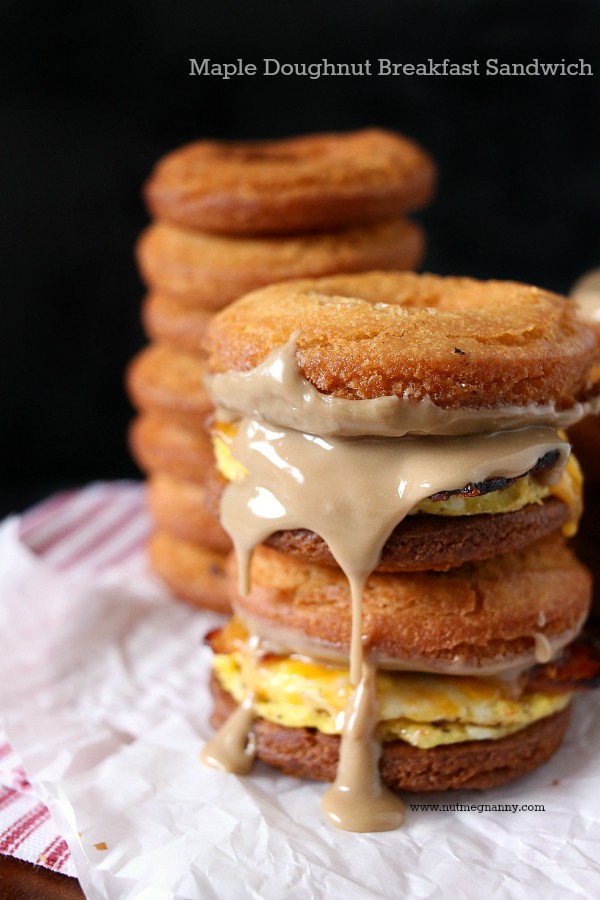 This doughnut breakfast sandwich combines homemade crispy doughnuts, eggs, bacon, cheese and lots of maple glaze. It's the perfect way to start your totally sweet day. 