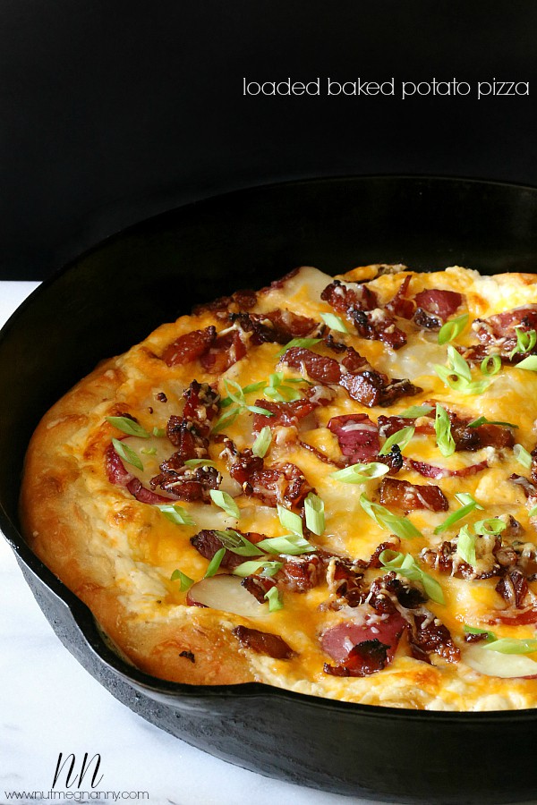 loaded baked potato pizza in a cast iron skillet