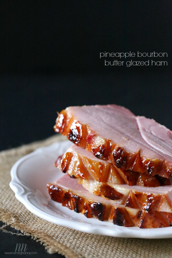 Pineapple Bourbon Butter Glazed Ham sliced on a platter. 