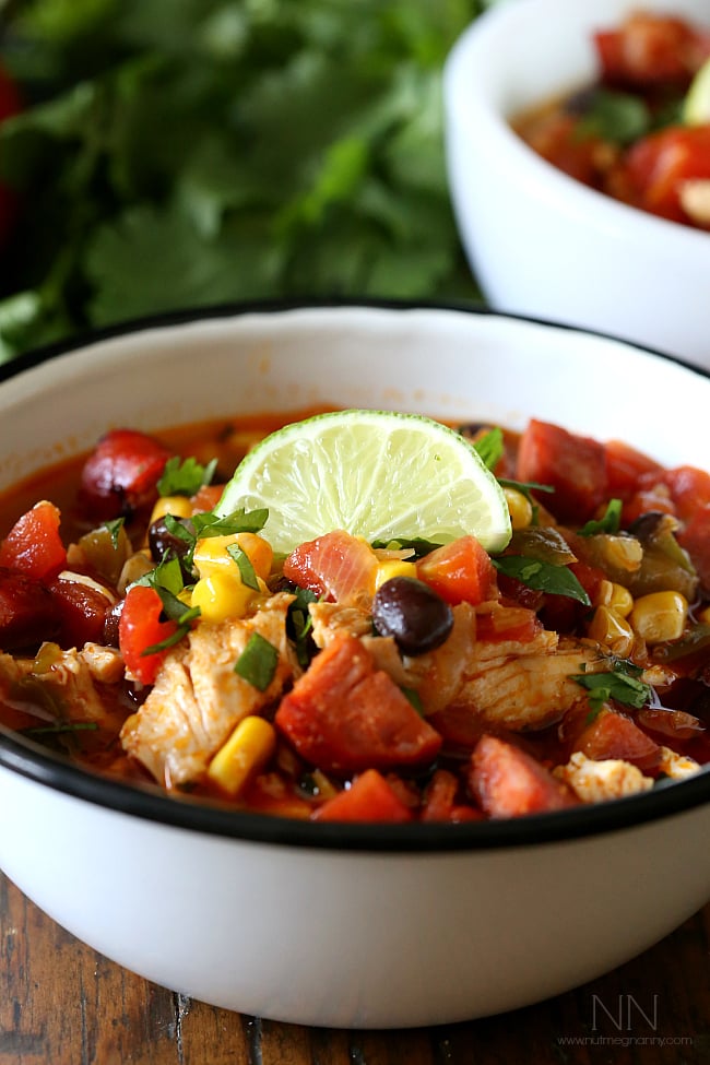Spicy Chicken Lime Soup topped with lime and cilantro. 