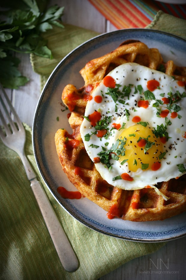 These cheddar sausage cornmeal waffles are packed full of sriracha, cheddar cheese and breakfast sausage. Top with a fried egg and call it breakfast.