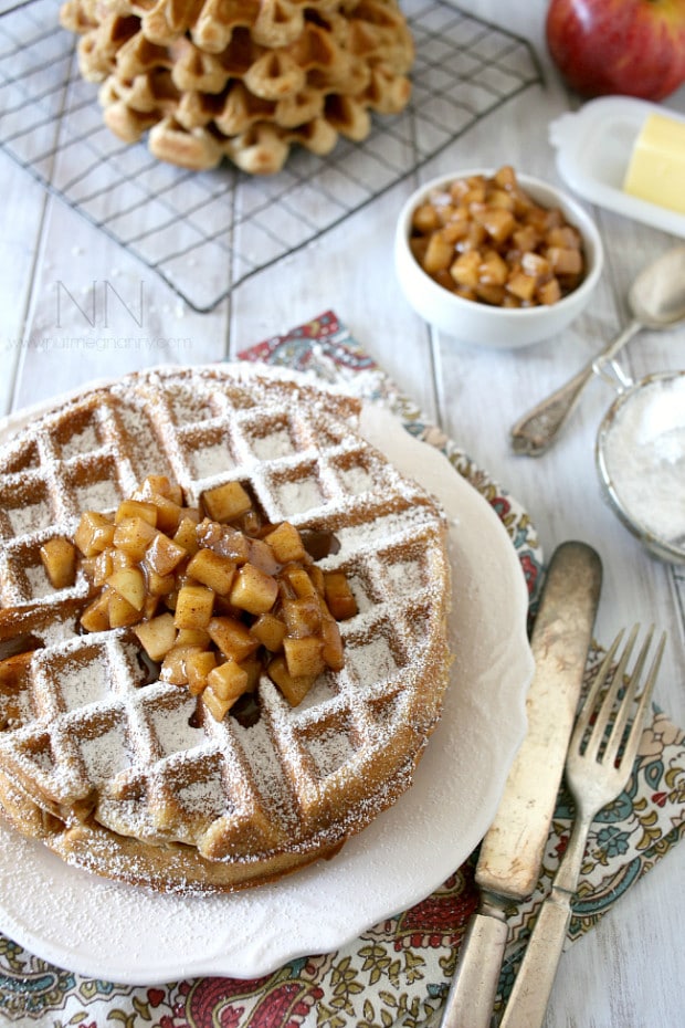 These gluten free apple cinnamon waffles are packed full of warm cinnamon apples and packed into an easy gluten free waffle recipe. This is the perfect way to start the day!