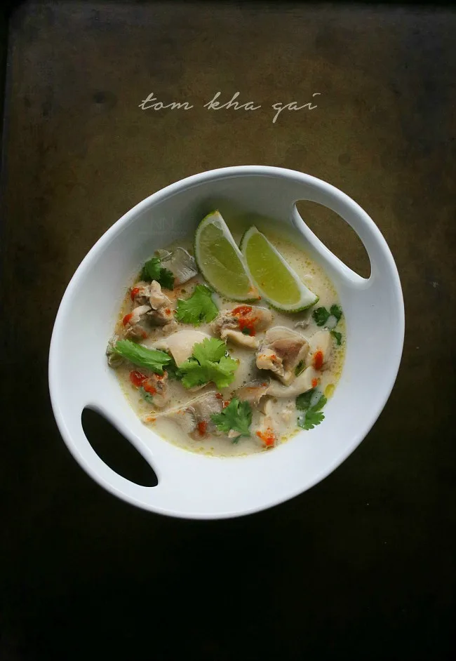 This Thai tom kha gai soup is a beautiful combination of chicken, mushrooms, ginger, lemongrass and coconut milk. Top with sriracha, cilantro and just a squeeze of lime.