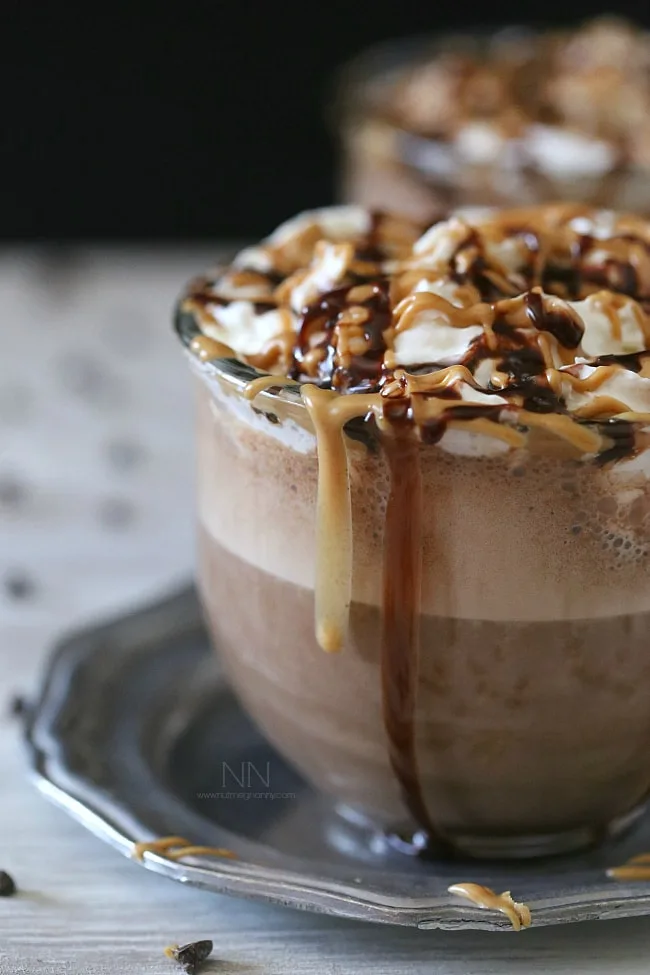 Peanut Butter Hot Chocolate topped with chocolate sauce and peanut butter. 