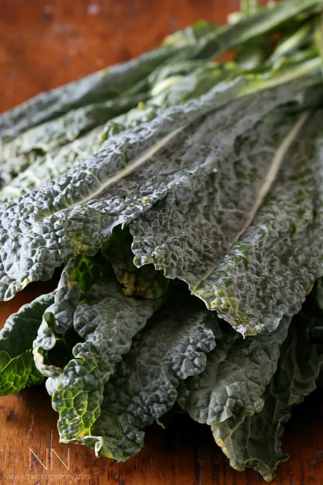 Tuscan kale sitting on a table. 
