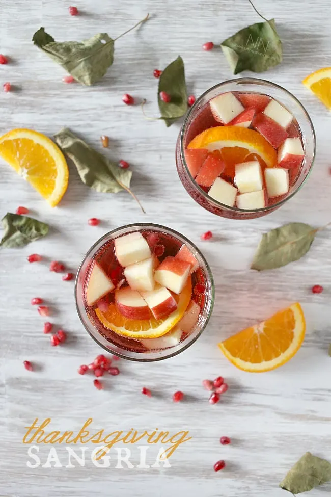 This simple Thanksgiving sangria is packed full of pomegranate seeds, apple, orange and semi sweet red wine. This drink is perfect for your holiday table.