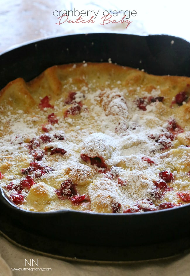 This cranberry orange Dutch baby is the highlight of your holiday season eating. Full of tart fresh cranberries and zesty orange flavor. Say hello to delicious!
