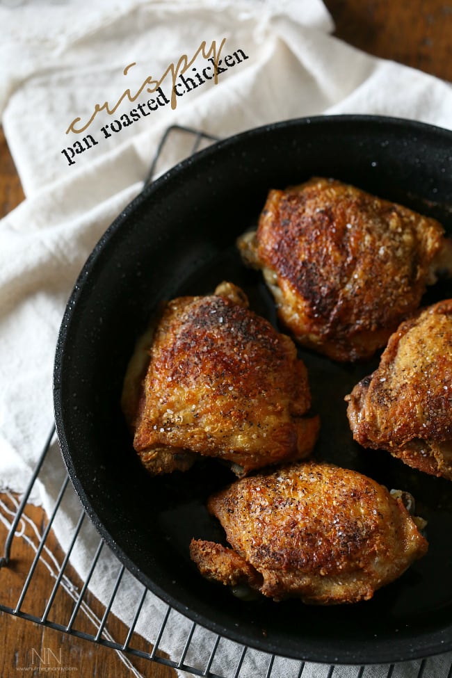 crispy pan roasted chicken thighs in a skillet