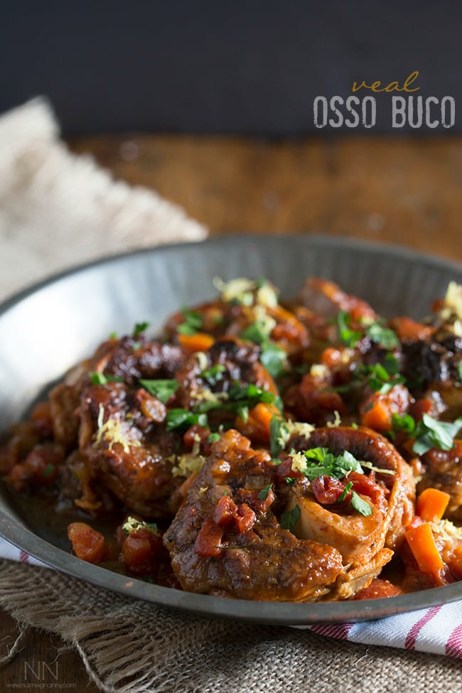 This homemade veal osso buco is the perfect holiday meal. Made with tomatoes, fresh herbs, a touch of white wine and a sprinkling of lemon zest. 