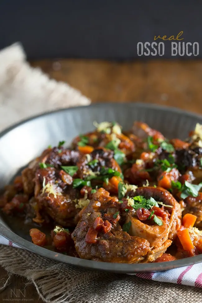 This homemade veal osso buco is the perfect holiday meal. Made with tomatoes, fresh herbs and a touch of white wine.