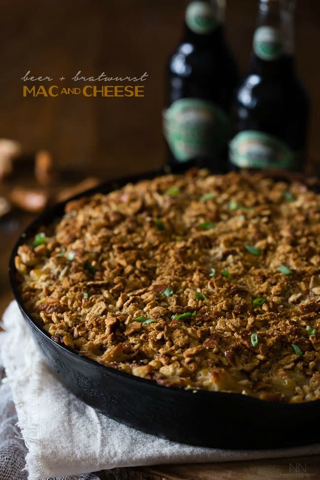 This super flavorful beer bratwurst macaroni and cheese is packed full of stringy cheese, beer, bratwurst and sprinkled with a crunchy pretzel topping.