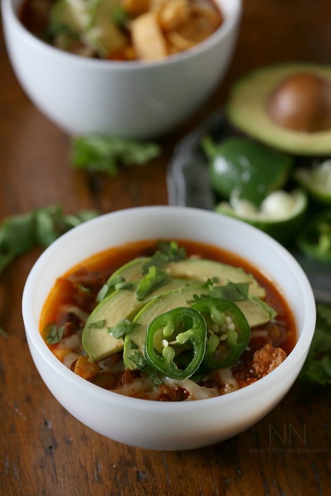 This slow cooker beef chorizo taco chili is packed full of flavor and perfect for cold winter nights. Serve topped with avocado, cheese and corn chips for the perfect filling bowl.